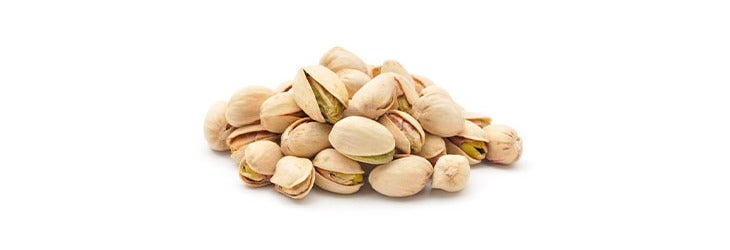 Puñado de pistachos con cáscara y sus beneficios